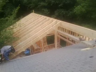 Framing a new roof addition that ties into an existing shingle roof in Ryegate